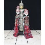 Pair of Balinese marionettes, in sequin burgundy traditional dress with carved decorative heads, 23"