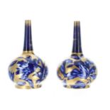 Pair of Thomas Forrester Pheonix Ware pottery bottle vases, overall with gilded decoration on a blue
