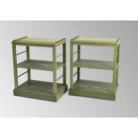 Decorative pair of green painted three tier open bookshelves of rectangular form applied with gilt