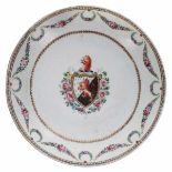 Chinese export armorial porcelain saucer dish, with a coat of arms within a floral garland border,