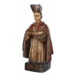 Large Continental carved wooden polychrome figure of a religious leader, modelled holding a book