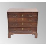 Early 19th century mahogany chest of drawers of small proportion, the crossbanded top over a