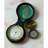 Gilded pocket barometer with a silvered dial and compass set to the reverse, in a Morocco case