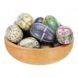 Collection of decorative tin metal egg-shaped boxes, each with differing decoration, each 4.5"