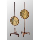 Pair of early 19th century mahogany pole screens, each with circular panelled watercolour, pen and