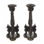Pair of French Empire style bronze candlesticks, foliate scrolling cast triangular supports raised