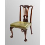 Georgian period Chippendale design mahogany library chair, the carved vase splat over a green