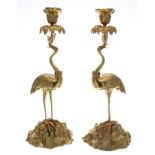 Pair of good quality gilt metal stork figural candlesticks, 16" high