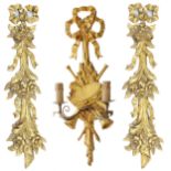 Pair of gold leaf gesso floral and foliate swag carved wall mounts, 29" high: together with gilt