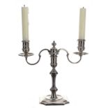 18th century style twin branch silver candelabra, raised on a knopped stem over a square canted