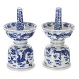 Pair of Chinese export blue and white porcelain candlesticks, of double bowl form decorated with