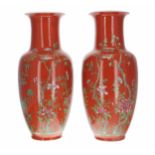 Pair of Chinese famille rose baluster vases, decorated with blossoming branches upon an orange