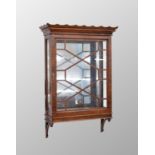 Mahogany glazed narrow wall display cabinet, with a waved rim cornice over a single astragal