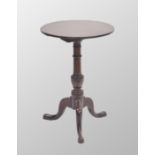 Small Georgian circular mahogany tripod table, the tilt-top upon a turned column and tripod base