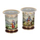 Pair of early 19th century English cylindrical porcelain vases, painted with figures and highland