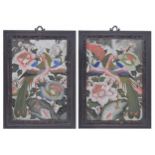 Pair of Chinese reverse painted mirrors, depicting birds amongst peonies, the frames with a fretwork