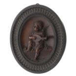 Valentino Panciera Besarel (1809-1922) - fine relief carved oval plaque depicting a cherub playing a