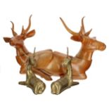 Pair of brass recumbent elk figures, 8" high; together with a pair larger carved treen recumbent