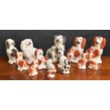 Collection of Victorian Staffordshire pottery dogs, tallest 8" high (14)