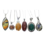 Two Karis platinum bonded mounted stone set pendants; together with two silver (925) mounted stone