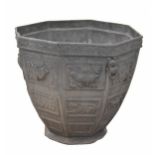 Octagonal lead garden planter, cast in relief with bird and foliage panels within rope twist