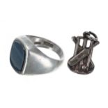 Gentleman's gunmetal and silver signet ring; together with a silver cricket pendant/charm (2)