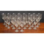 Collection of drinking glasses, on twist stems, including ten wine glasses 7.5" high, six flutes and