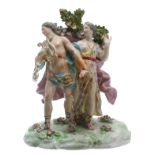 Samson porcelain figural group, modelled as a gentleman with a lyre, standing beside a lady, both by