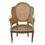 Louis XVI style gilt and bergere panelled chair, the back with carved harebell borders over back and