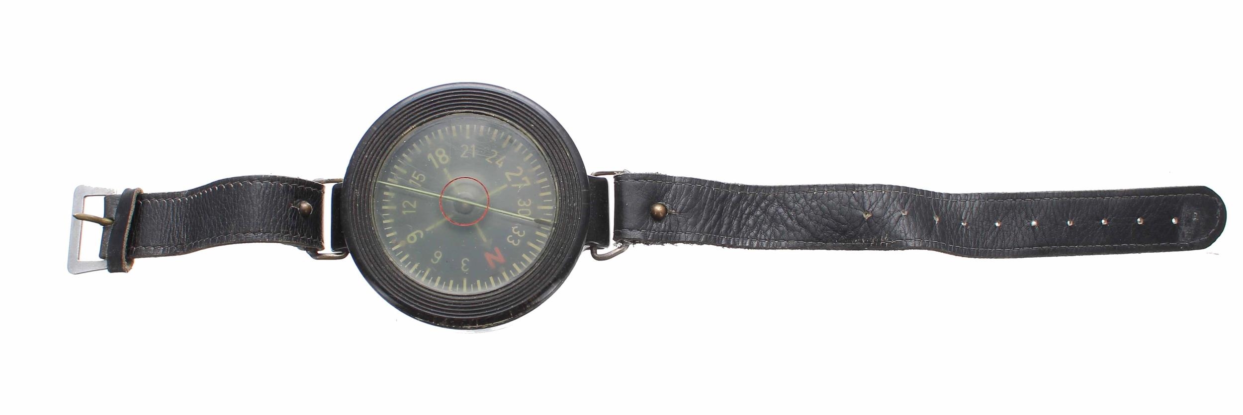 WWII Luftwaffe wrist compass on a leather strap, stamped AK 39 FI 23235-1 6cm diameter