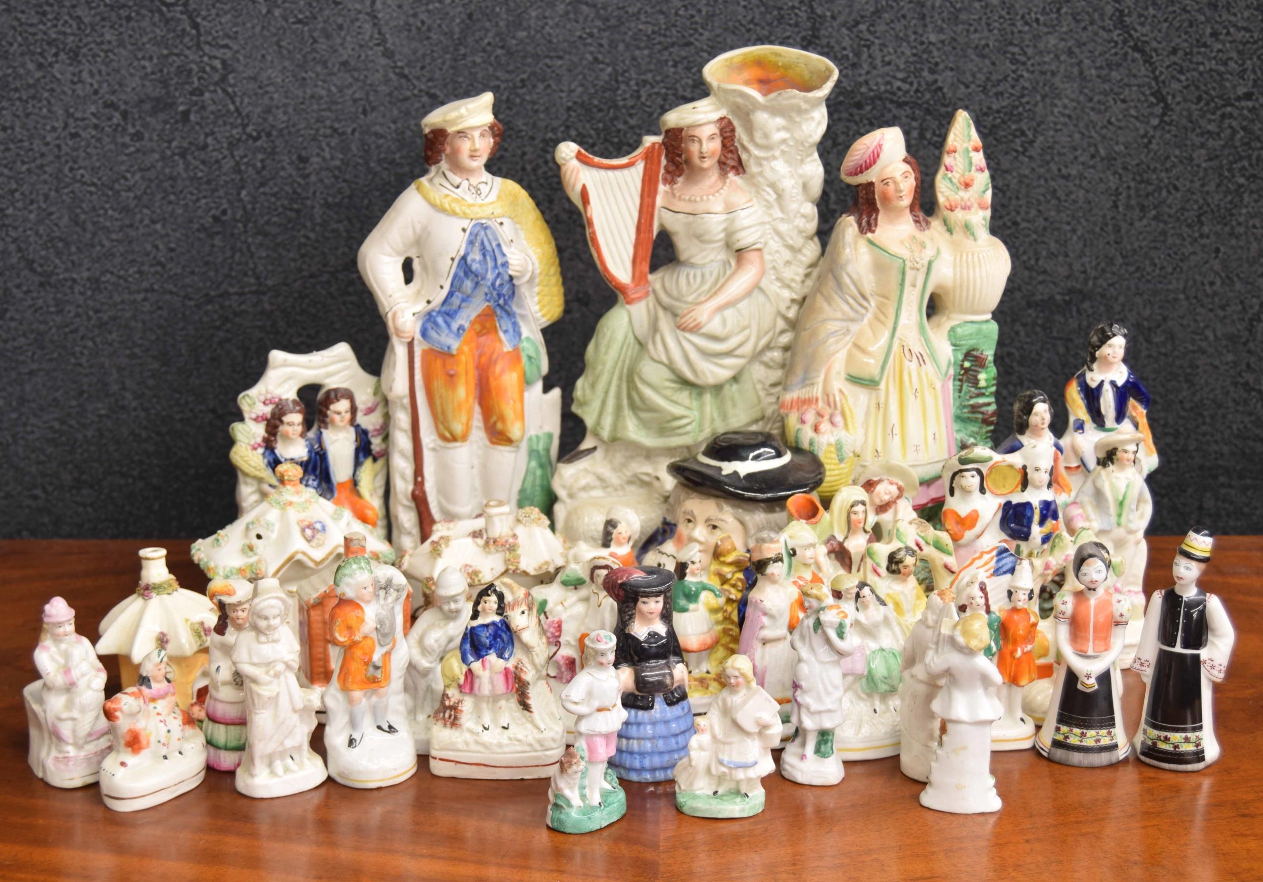 Collection of Staffordshire pottery figures, including three large figures and assorted