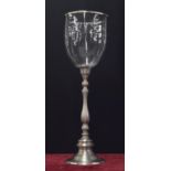 Decorative tall chromed candle stand, with a storm shade upon a turned column with circular base,