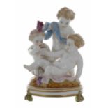 French Vion et Baury porcelain figural group of three putti drinking wine, modelled on a