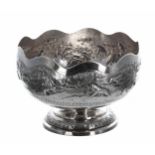 White metal bowl repoussé decorated with animals in a landscape, possibly Burmese, marked T90, 8"