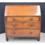 Georgian mahogany bureau, the hinged fall-front enclosing a fitted interior with drawers, over three