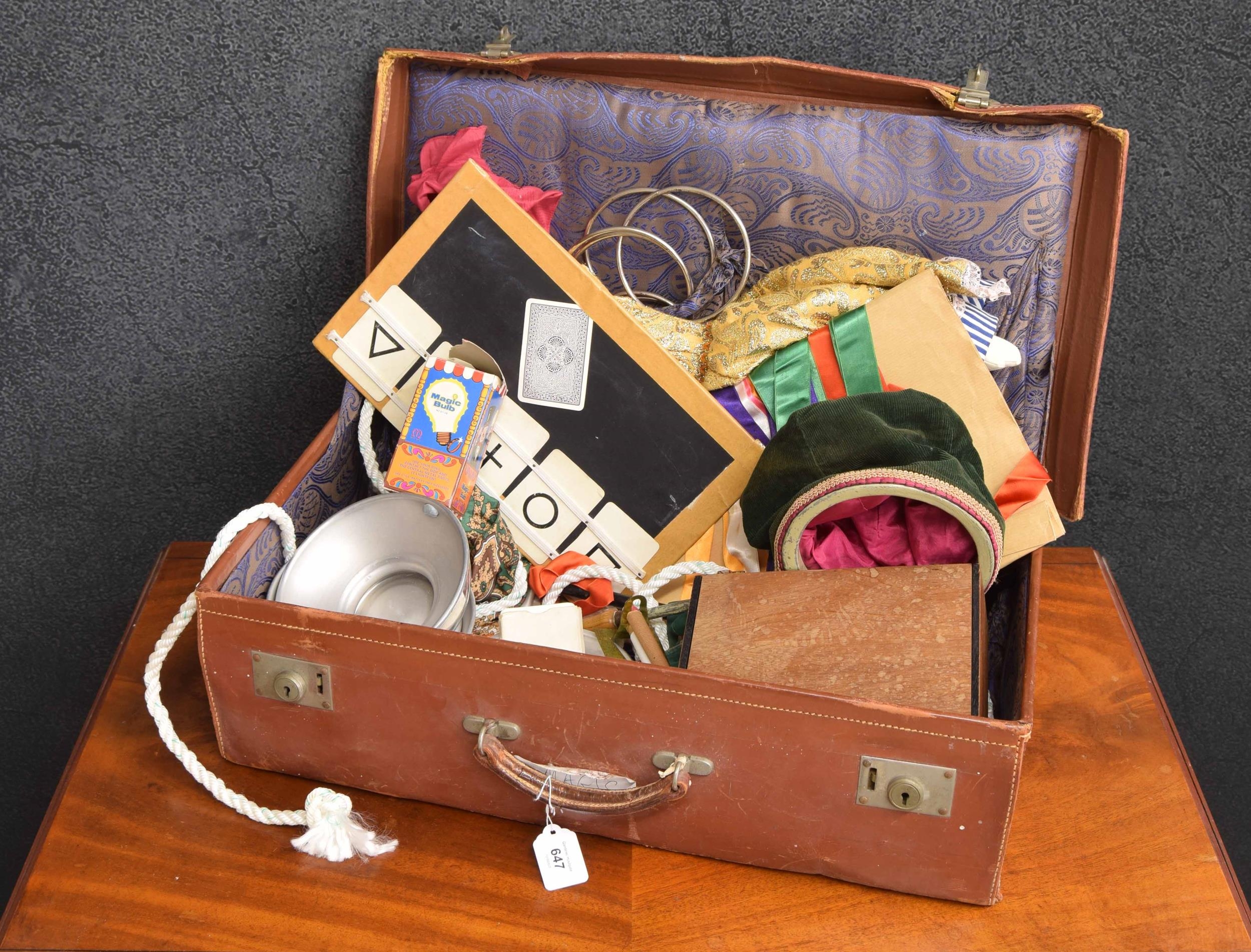Suitcase containing a collection of assorted vintage magic toys/tricks etc.