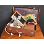 Suitcase containing a collection of assorted vintage magic toys/tricks etc.