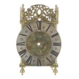Good English period lantern clock frame, the 6.5" silvered chapter ring enclosing a foliate engraved