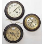 Two Synchronome 8" dial slave clocks in oak cases; also a D.E.H.O 7" dial slave clock within a