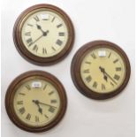 Three Gillett & Johnson 8" dial slave clocks, two with early swing armature, all in turned oak cases