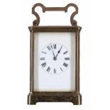 French carriage clock striking on a gong, within a corniche brass case, 7.25" high