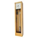 Gents electric master wall clock, the 8" square dial within a glazed light oak case, 50.5" high