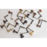 Fifteen brass and iron crank keys with turned wooden handles (15)