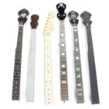 Five unnamed old banjo necks; also a guitar neck (6)