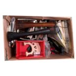 Box of various stringed instrument fittings including bridges, tailpieces, chin rests etc