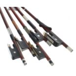 Nickel mounted violoncello bow stamped Erich Stiner; also four nickel mounted violin bows (5)