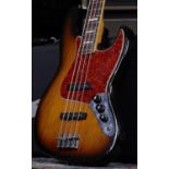 1966 Fender Jazz Bass guitar, made in USA; Body: sunburst finish, fading to front, mild fading to