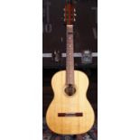 Mozzanni classical guitar; Back and sides: maple, a few light marks; Top: natural spruce, lacquer