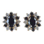 Pair of 18ct yellow gold sapphire and diamond oval cluster earrings, with a border of round