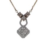 Attractive 14k diamond set pendant on a slender yellow gold necklace, princess and round brilliant-